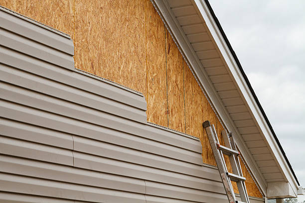 Professional Siding Contractor technician working in Hudson, MA
